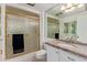 Bathroom featuring a granite countertop vanity and a frosted glass shower enclosure at 18211 N Conestoga Dr, Sun City, AZ 85373