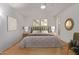 Bright bedroom featuring a ceiling fan, light walls, and stylish decor at 18211 N Conestoga Dr, Sun City, AZ 85373