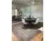 Dining room features a modern table and stylish chairs, enhanced by a mirrored wall at 18211 N Conestoga Dr, Sun City, AZ 85373