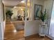 Inviting entryway with hardwood floors, decorative mirror wall, and stylish accents at 18211 N Conestoga Dr, Sun City, AZ 85373