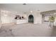 Open-concept layout seamlessly connecting living area and kitchen with modern appliances at 18211 N Conestoga Dr, Sun City, AZ 85373