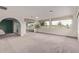 Spacious living room featuring large windows with great views and an open layout at 18211 N Conestoga Dr, Sun City, AZ 85373