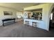 Open living area with breakfast bar seating and cozy window seat overlooking the backyard at 18211 N Conestoga Dr, Sun City, AZ 85373