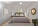 Stylishly decorated primary bedroom with modern décor and a plush king-sized bed at 18211 N Conestoga Dr, Sun City, AZ 85373
