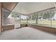 Enclosed patio overlooking the green golf course and serene landscape views at 18211 N Conestoga Dr, Sun City, AZ 85373