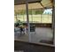 Relaxing screened-in porch with comfortable seating and views of the green golf course at 18211 N Conestoga Dr, Sun City, AZ 85373