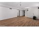 Spacious basement with wood-look floors, movie projector, and speakers ready for media enjoyment at 19412 N 77Th Ave, Glendale, AZ 85308