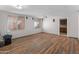 Large basement featuring wood-look flooring, two windows, movie projector and speakers for entertainment at 19412 N 77Th Ave, Glendale, AZ 85308