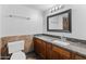 Bathroom vanity with stylish granite countertop and decorative tile backsplash at 19412 N 77Th Ave, Glendale, AZ 85308