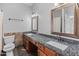 The bathroom boasts dual sinks, granite countertops, and a spacious vanity at 19412 N 77Th Ave, Glendale, AZ 85308