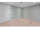 Bedroom featuring neutral walls, carpeting, and a door leading to another room at 19412 N 77Th Ave, Glendale, AZ 85308