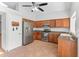 Bright kitchen featuring wood cabinets, stainless steel appliances, and an efficient layout for cooking at 19412 N 77Th Ave, Glendale, AZ 85308