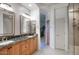 Elegant bathroom features granite counters, dual sinks, and a glass-enclosed shower at 19475 N Grayhawk Dr # 1046, Scottsdale, AZ 85255