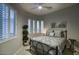 Comfortable bedroom with a ceiling fan and bay windows offering abundant natural light at 19475 N Grayhawk Dr # 1046, Scottsdale, AZ 85255