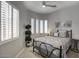 Cozy bedroom with a queen-size bed, lots of natural light, and neutral paint at 19475 N Grayhawk Dr # 1046, Scottsdale, AZ 85255