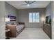 This well-lit bedroom features neutral colors and a ceiling fan for added comfort at 19475 N Grayhawk Dr # 1046, Scottsdale, AZ 85255