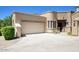 Charming single-story home featuring a two-car garage, tile roof, and well-maintained landscaping at 19475 N Grayhawk Dr # 1046, Scottsdale, AZ 85255