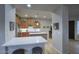 Well-lit kitchen with stainless steel appliances, a central island, and an inviting breakfast bar at 19475 N Grayhawk Dr # 1046, Scottsdale, AZ 85255