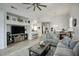 Bright living room with stylish furniture, vaulted ceilings, and wood-look tile floors at 19475 N Grayhawk Dr # 1046, Scottsdale, AZ 85255