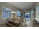 Open-concept living area featuring neutral tones, plantation shutters, and seamless access to the outdoor patio at 19475 N Grayhawk Dr # 1046, Scottsdale, AZ 85255