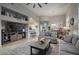 Bright and airy living space with a media center, seamlessly flowing into the dining area and kitchen at 19475 N Grayhawk Dr # 1046, Scottsdale, AZ 85255