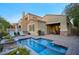 Inviting backyard with a sparkling pool and a cozy patio area, perfect for outdoor entertaining at 19475 N Grayhawk Dr # 1046, Scottsdale, AZ 85255