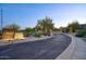 A clean street view showcases the inviting Tesoro at Grayhawk community entrance at 19475 N Grayhawk Dr # 1046, Scottsdale, AZ 85255