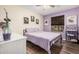 Inviting bedroom with lovely lilac color scheme and natural light at 20053 N 15Th Dr, Phoenix, AZ 85027
