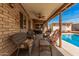 Covered patio with an outdoor seating area and view of the pool and backyard at 20053 N 15Th Dr, Phoenix, AZ 85027