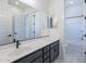 Contemporary bathroom with dual sinks, white countertops, and access to the shower at 20258 W Catalina Dr, Buckeye, AZ 85396