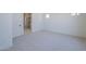 Bedroom featuring neutral paint, carpet, baseboards, a window, and an ensuite bathroom at 20258 W Catalina Dr, Buckeye, AZ 85396