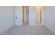 Clean bedroom featuring neutral carpet and white interior doors at 20258 W Catalina Dr, Buckeye, AZ 85396