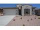 Inviting single-story home with a two car garage and low maintenance desert landscaping at 20258 W Catalina Dr, Buckeye, AZ 85396