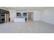 Open concept kitchen featuring dark cabinets, a kitchen island and stainless steel appliances at 20258 W Catalina Dr, Buckeye, AZ 85396
