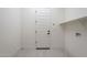 Laundry room featuring a single shelf and a tile floor at 20258 W Catalina Dr, Buckeye, AZ 85396