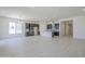 Bright open concept living room and kitchen area with tiled floors and recessed lighting at 20258 W Catalina Dr, Buckeye, AZ 85396