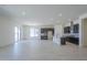 Bright open concept living room and kitchen area with tiled floors and natural light at 20258 W Catalina Dr, Buckeye, AZ 85396