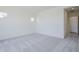 Light-filled bedroom with gray carpeting and neutral walls, offering a calm and inviting atmosphere at 20263 W Catalina Dr, Buckeye, AZ 85396