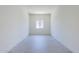 Bright bedroom with light wood flooring and a window offering ample natural light at 20263 W Catalina Dr, Buckeye, AZ 85396