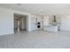 Spacious open-plan living area featuring hardwood floors, a modern kitchen, and plenty of natural light at 20263 W Catalina Dr, Buckeye, AZ 85396