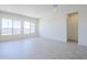 Bright living room features recessed lighting, large windows, and stylish vinyl flooring at 20263 W Catalina Dr, Buckeye, AZ 85396