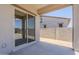 A covered patio provides a transition to the outdoors with concrete flooring and sliding glass doors at 20263 W Catalina Dr, Buckeye, AZ 85396