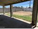 Covered patio overlooking the backyard, creating a shaded area for relaxation and entertainment at 299 N Comanche Dr, Chandler, AZ 85224