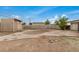 Large backyard with desert landscaping and a cinder block fence, offering a private outdoor space at 299 N Comanche Dr, Chandler, AZ 85224