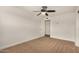 Bedroom featuring neutral carpet, a modern ceiling fan, and white trim throughout at 299 N Comanche Dr, Chandler, AZ 85224