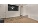 Bright living room featuring wood-look flooring and carpet, a TV, and neutral paint at 299 N Comanche Dr, Chandler, AZ 85224