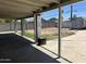 View of the spacious covered patio and backyard, providing ample space for outdoor activities at 299 N Comanche Dr, Chandler, AZ 85224