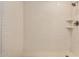 This is a shower with tile walls, built-in shelves and hexagon tiles on the floor at 299 N Comanche Dr, Chandler, AZ 85224