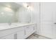 Modern bathroom with double sinks, marble countertops, and a glass-enclosed shower at 3131 N Central Ave # 7002, Phoenix, AZ 85012