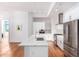Kitchen with a marble island, stainless steel appliances, and hardwood floors with lots of space at 3131 N Central Ave # 7002, Phoenix, AZ 85012